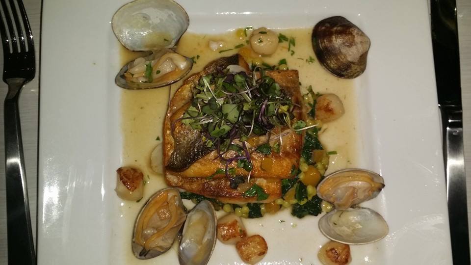 Pan Seared Branzino, spinach cous cous, lemon brodetto, clans , scallops, with roasted pumpkin