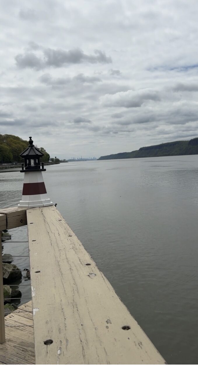 Hudson River waterfront view in Westchester County with New York City skyline in the distance, a perfect backdrop for brunch along the river.