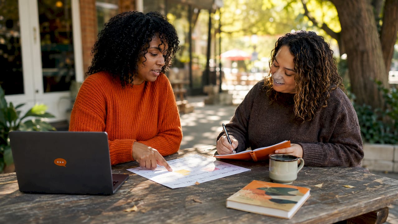 Travel bloggers planning content strategy together