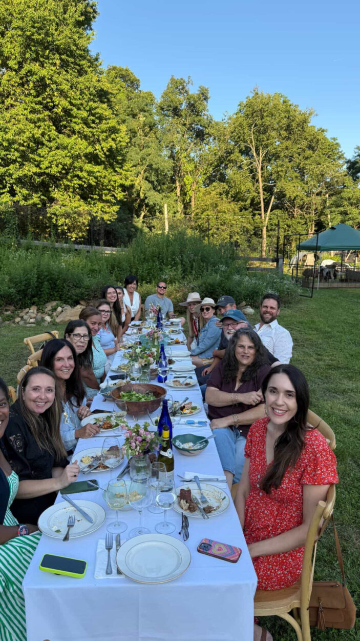 Guests enjoying an outdoor farm-to-table dinner at The Farm at Cabbage Hill in Mount Kisco.