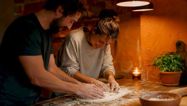 Couple preparing dinner together in warm kitchen