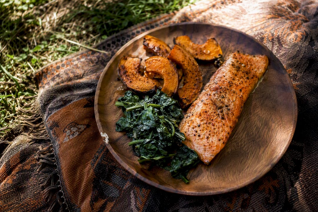Baked salmon dinner with spinach and sweet potato