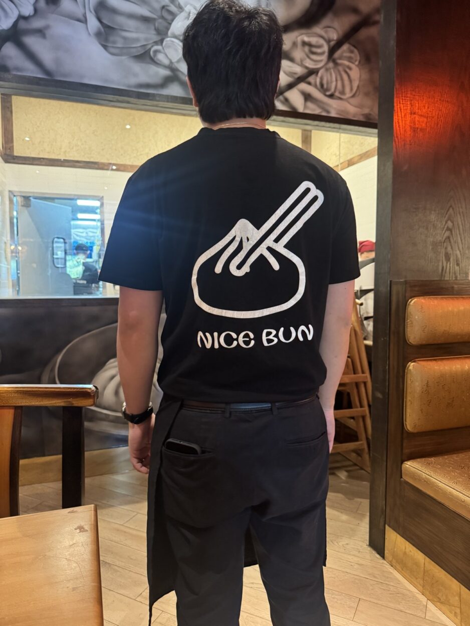 Nana's Dim Sum & Dumplings staff t-shirt reading NICE BUN with a steamed bun graphic