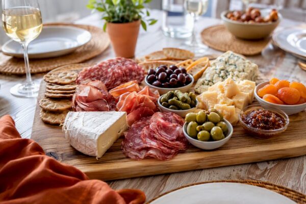 Colorful charcuterie board with cheeses and meats