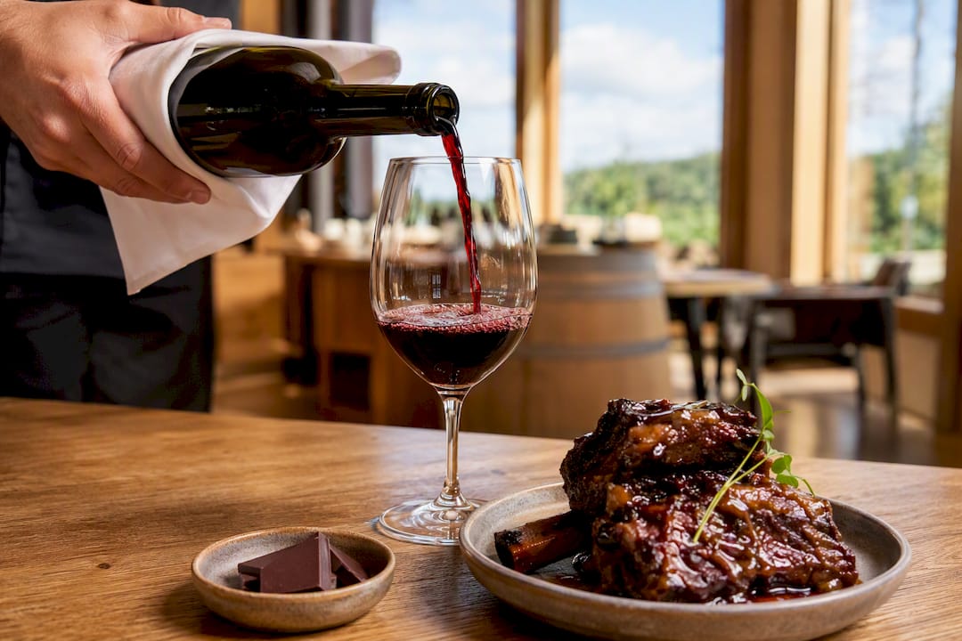 Malbec poured beside short ribs