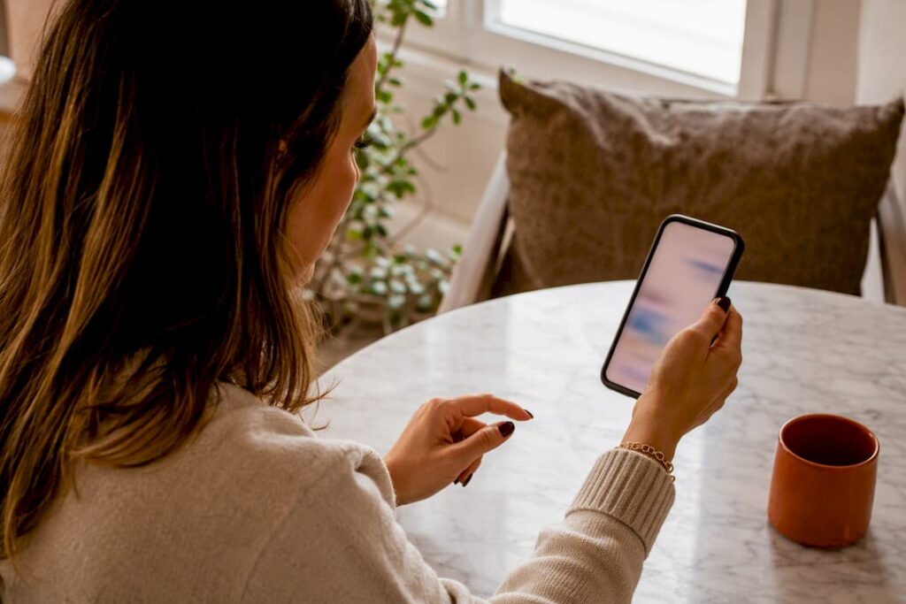 Hand pausing over ambiguous text conversation